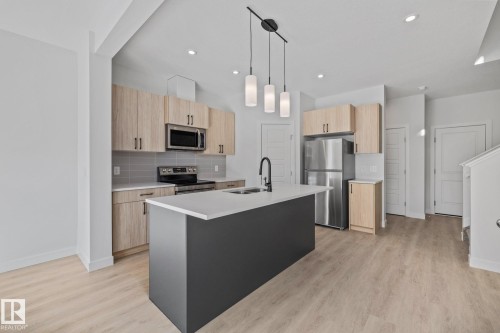 112 Honeysuckle Green, Leduc, AB - Indoor Photo Showing Kitchen With Double Sink With Upgraded Kitchen