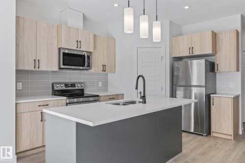 112 Honeysuckle Green, Leduc, AB - Indoor Photo Showing Kitchen With Double Sink With Upgraded Kitchen
