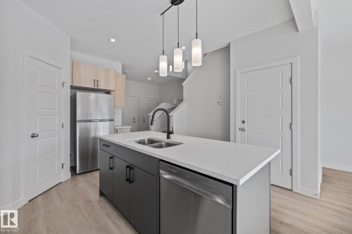 112 Honeysuckle Green, Leduc, AB - Indoor Photo Showing Kitchen With Double Sink