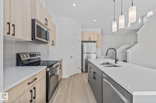 112 Honeysuckle Green, Leduc, AB - Indoor Photo Showing Kitchen With Double Sink With Upgraded Kitchen