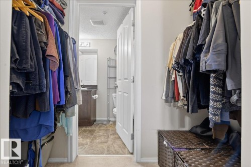View of walk in closet - 305 12045 22 Avenue, Edmonton, AB - Indoor With Storage