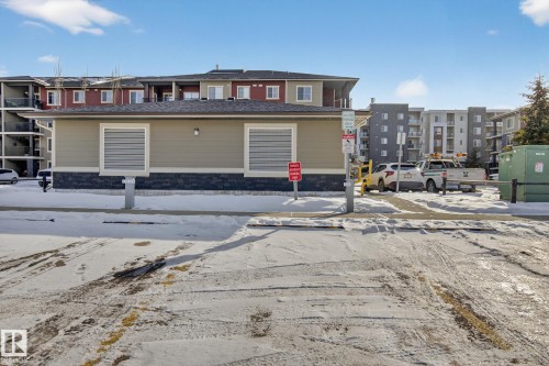 Snow covered property with a view of apartment building / complex - 305 12045 22 Avenue, Edmonton, AB - Outdoor