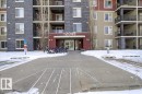 Snow covered building featuring a view of apartment building / complex - 305 12045 22 Avenue, Edmonton, AB  - Outdoor With Facade 