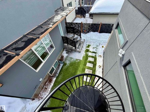View of snow covered back of property - 10038 142 Street, Edmonton, AB - Outdoor With Exterior
