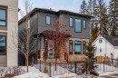 Modern home with a fenced front yard, stone siding, and stucco siding - 10038 142 Street, Edmonton, AB  - Outdoor 