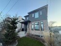 Modern facade featuring stone veneer and dark gray siding - 10038 142 Street, Edmonton, AB  - Outdoor 