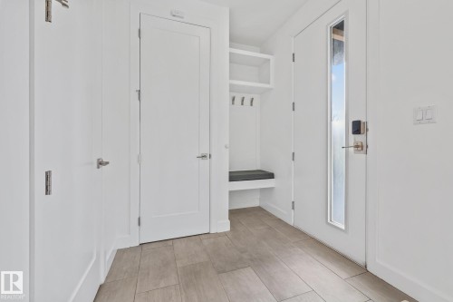 Corridor featuring wood tiled floors - 10038 142 Street, Edmonton, AB - Indoor Photo Showing Other Room