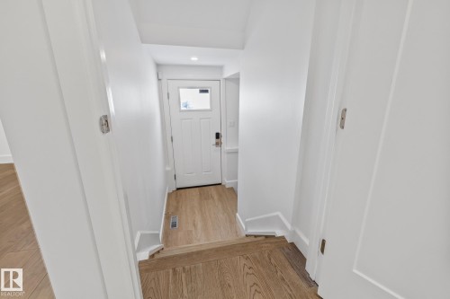 Doorway featuring wood finished floors and recessed lighting - 10038 142 Street, Edmonton, AB - Indoor Photo Showing Other Room