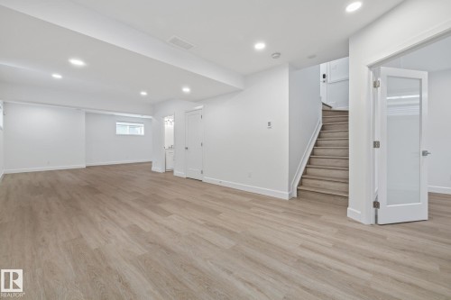 Basement featuring light wood-style flooring and recessed lighting - 10038 142 Street, Edmonton, AB - Indoor