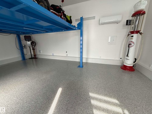 Garage with water heater and a wall mounted mini split - 10038 142 Street, Edmonton, AB - Indoor