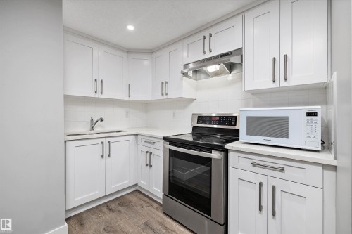 3380 Chickadee Drive, Edmonton, AB - Indoor Photo Showing Kitchen With Double Sink