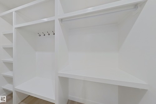 Mudroom featuring light wood finished floors - 3158 Magpie Way, Edmonton, AB - Indoor With Storage