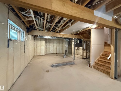 Basement featuring stairway and heating unit - 3158 Magpie Way, Edmonton, AB - Indoor Photo Showing Basement