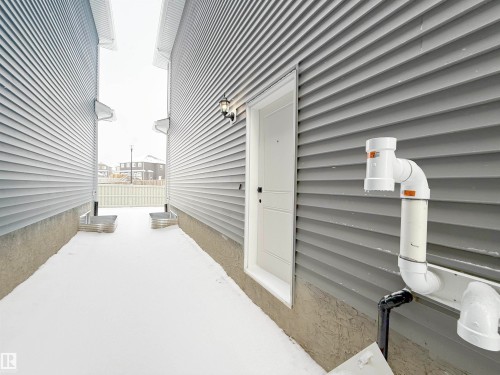 Entrance to property with a patio - 3158 Magpie Way, Edmonton, AB - Outdoor With Exterior