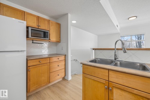 2 1179 Summerside Drive, Edmonton, AB - Indoor Photo Showing Kitchen With Double Sink