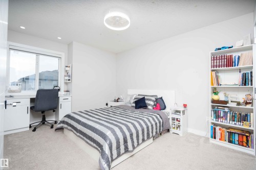 Bedroom with an office area, light carpet, and recessed lighting - 43 1703 16 Avenue, Edmonton, AB - Indoor Photo Showing Bedroom