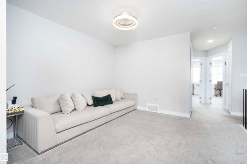 Living room with carpet and recessed lighting - 43 1703 16 Avenue, Edmonton, AB - Indoor