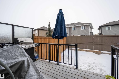 Wooden deck featuring grilling area - 43 1703 16 Avenue, Edmonton, AB - Outdoor With Exterior