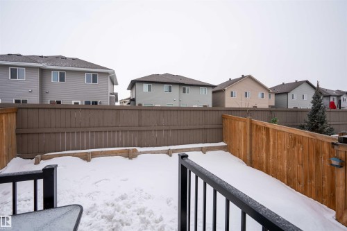 Fenced backyard featuring a residential view - 43 1703 16 Avenue, Edmonton, AB - Outdoor With Exterior