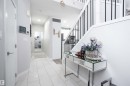 Hall featuring stairs and light tile patterned flooring - 43 1703 16 Avenue, Edmonton, AB  - Indoor Photo Showing Other Room 
