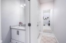 Bathroom featuring vanity and light tile patterned floors - 43 1703 16 Avenue, Edmonton, AB  - Indoor Photo Showing Bathroom 
