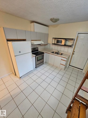 Edmonton, AB - Indoor Photo Showing Kitchen With Double Sink