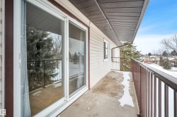 View of snow covered back of property - 