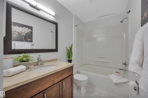 Full bath with vanity and tub / shower combination - 201 237 Woodvale Road W, Edmonton, AB - Indoor Photo Showing Bathroom