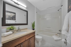 Full bath with vanity and tub / shower combination - 