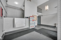 View of community featuring mail area and a high ceiling - 