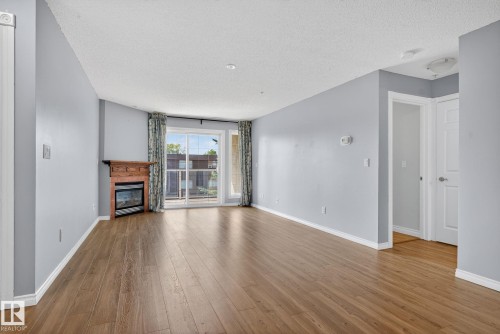 314 12110 106 Avenue, Edmonton, AB - Indoor Photo Showing Living Room With Fireplace