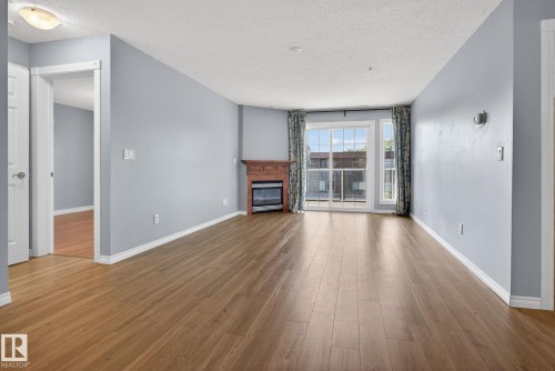 314 12110 106 Avenue, Edmonton, AB - Indoor Photo Showing Living Room With Fireplace