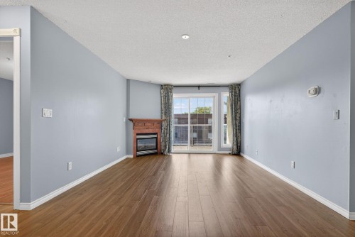 314 12110 106 Avenue, Edmonton, AB - Indoor Photo Showing Living Room With Fireplace