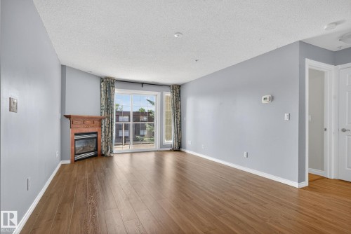 314 12110 106 Avenue, Edmonton, AB - Indoor Photo Showing Living Room With Fireplace