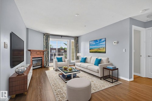 314 12110 106 Avenue, Edmonton, AB - Indoor Photo Showing Living Room With Fireplace