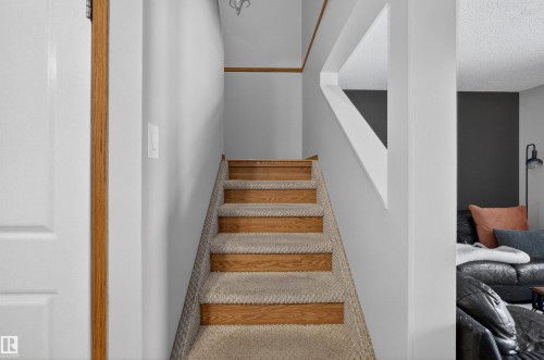 Stairway featuring a textured ceiling - 14648 54 Street, Edmonton, AB - Indoor Photo Showing Other Room