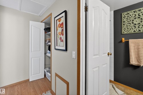 Corridor featuring baseboards and light wood finished floors - 14648 54 Street, Edmonton, AB - Indoor Photo Showing Other Room