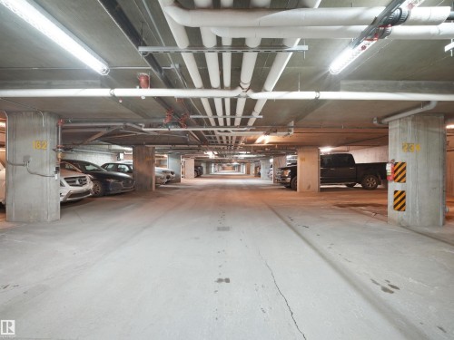 Garage featuring a parking garage - 422 5816 Mullen Place, Edmonton, AB - Indoor Photo Showing Garage