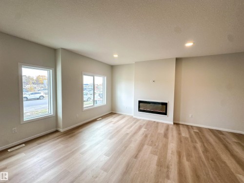 107 Brickyard Drive, Stony Plain, AB - Indoor Photo Showing Living Room With Fireplace