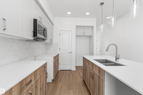 1020 14 Avenue, Edmonton, AB - Indoor Photo Showing Kitchen With Double Sink
