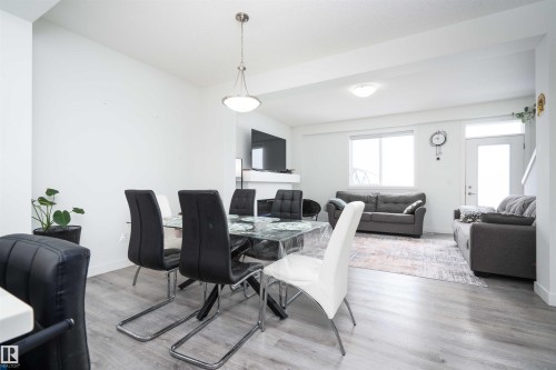 Dining area with light wood finished floors - 24 2072 Wonnacott Way, Edmonton, AB - Indoor