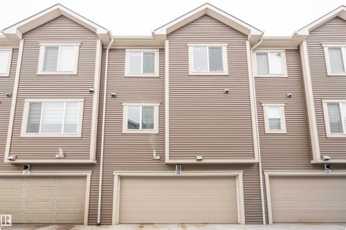 View of front of house featuring a garage - 24 2072 Wonnacott Way, Edmonton, AB - Outdoor