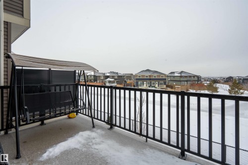 Balcony with a residential view - 24 2072 Wonnacott Way, Edmonton, AB - Outdoor With Balcony
