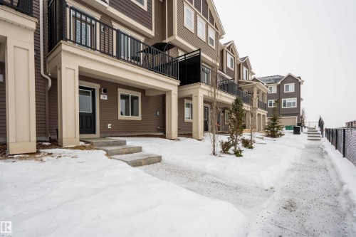 View of property's community featuring a balcony - 24 2072 Wonnacott Way, Edmonton, AB - Outdoor With Balcony With Facade