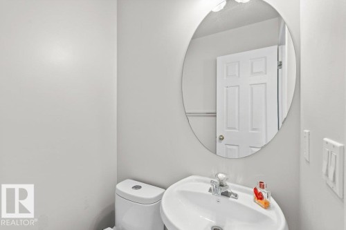 Half bath featuring a sink and toilet - 11608 11A Avenue, Edmonton, AB - Indoor Photo Showing Bathroom