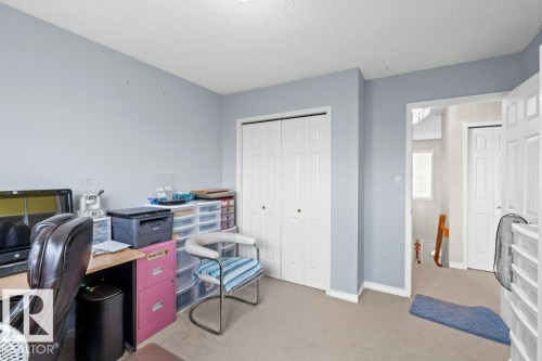 Office area featuring light colored carpet and a textured ceiling - 11608 11A Avenue, Edmonton, AB - Indoor