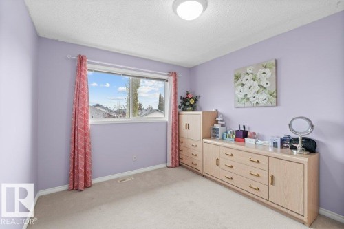 Bedroom featuring light carpet and a textured ceiling - 11608 11A Avenue, Edmonton, AB - Indoor Photo Showing Other Room