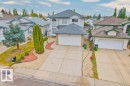 Traditional-style home featuring a garage, a residential view, and concrete driveway - 11608 11A Avenue, Edmonton, AB  - Outdoor 