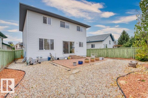 Rear view of property with a fenced backyard and a patio area - 11608 11A Avenue, Edmonton, AB - Outdoor