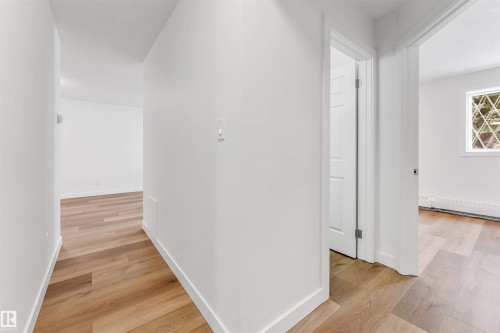 Hall with light wood-type flooring - 107 9760 176 St, Edmonton, AB - Indoor Photo Showing Other Room